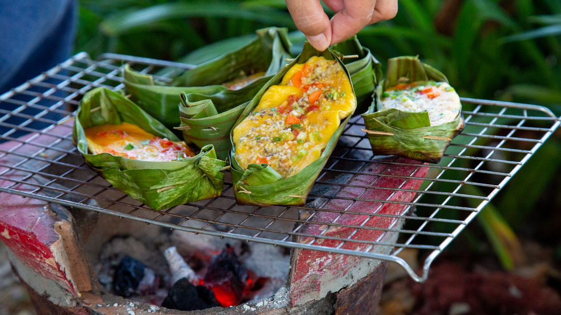 Grilled Red Ant Eggs in Banana Leaf Boat Khai Pam Mot Daeng ไข่ป่าม